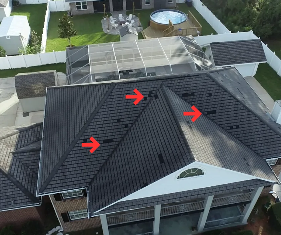 Roof inspection photo showing marked roof damage areas