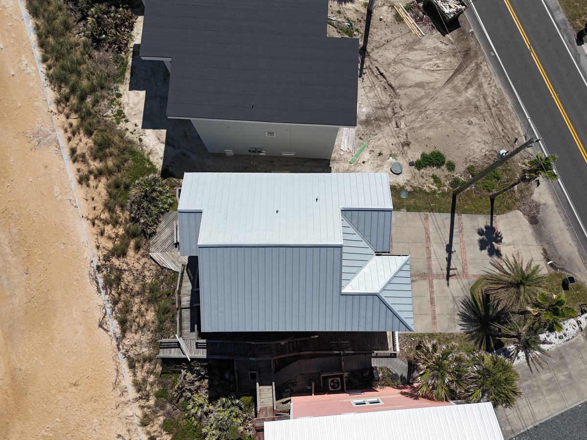 Pewter standing seam metal roof on a beachfront Florida home